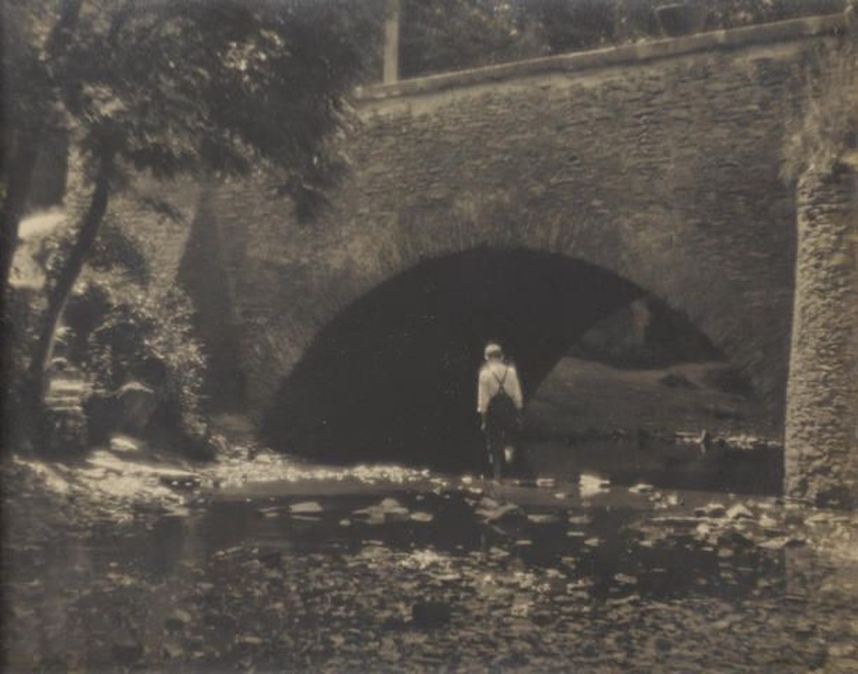 Untitled (Boy crossing stream) by Josef Sudek