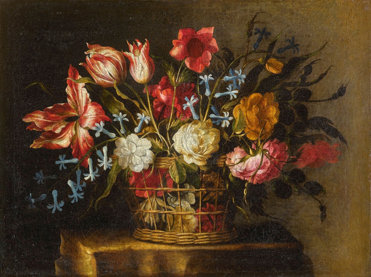 STILL LIFE OF TULIPS, BLUEBELLS AND OTHER FLOWERS IN A BASKET ON A STONE PEDESTAL by Juan de Arellano