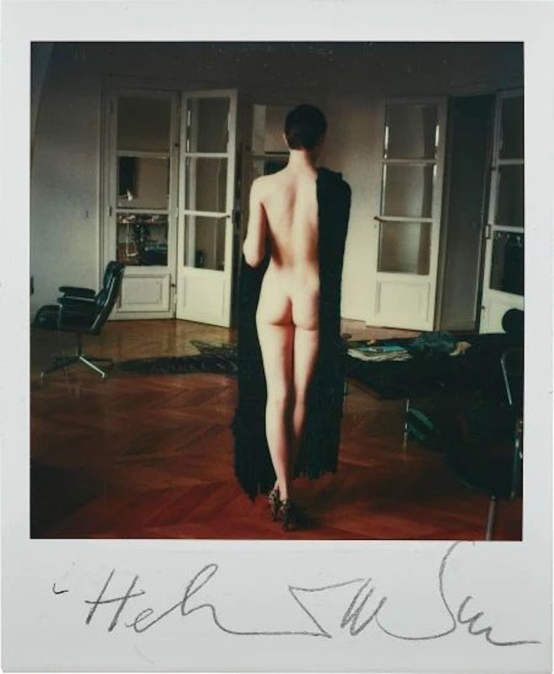 Full length nude, standing by Helmut Newton