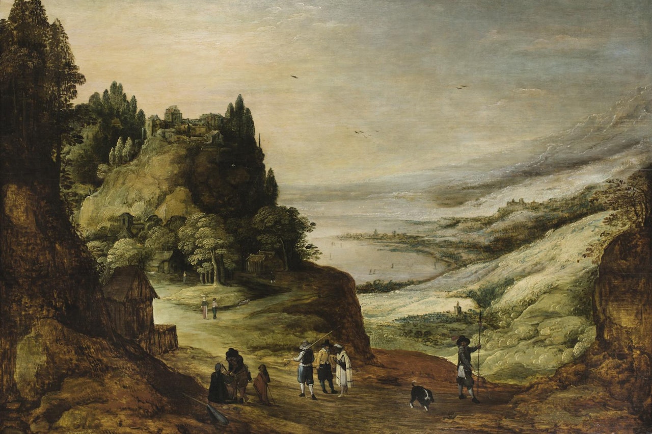 A PANORAMIC MOUNTAINOUS RIVER LANDSCAPE WITH TRAVELLERS ON A PATH TOGETHER WITH A DOG, A FORTIFIED VILLAGE ON A MOUNTAINTOP NEARBY AND OTHER VILLAGE IN THE FAR DISTANCE by Joos de Momper the Younger