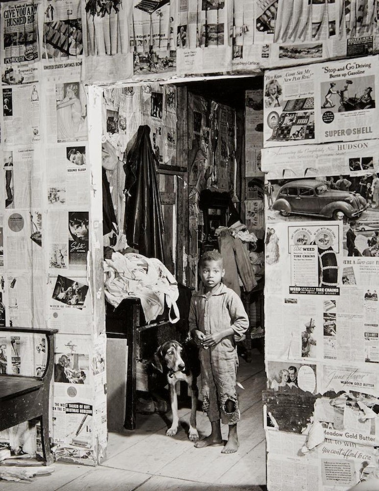 Boy with Hound Dog; Woman reading by fireplace by Margaret Bourke-White