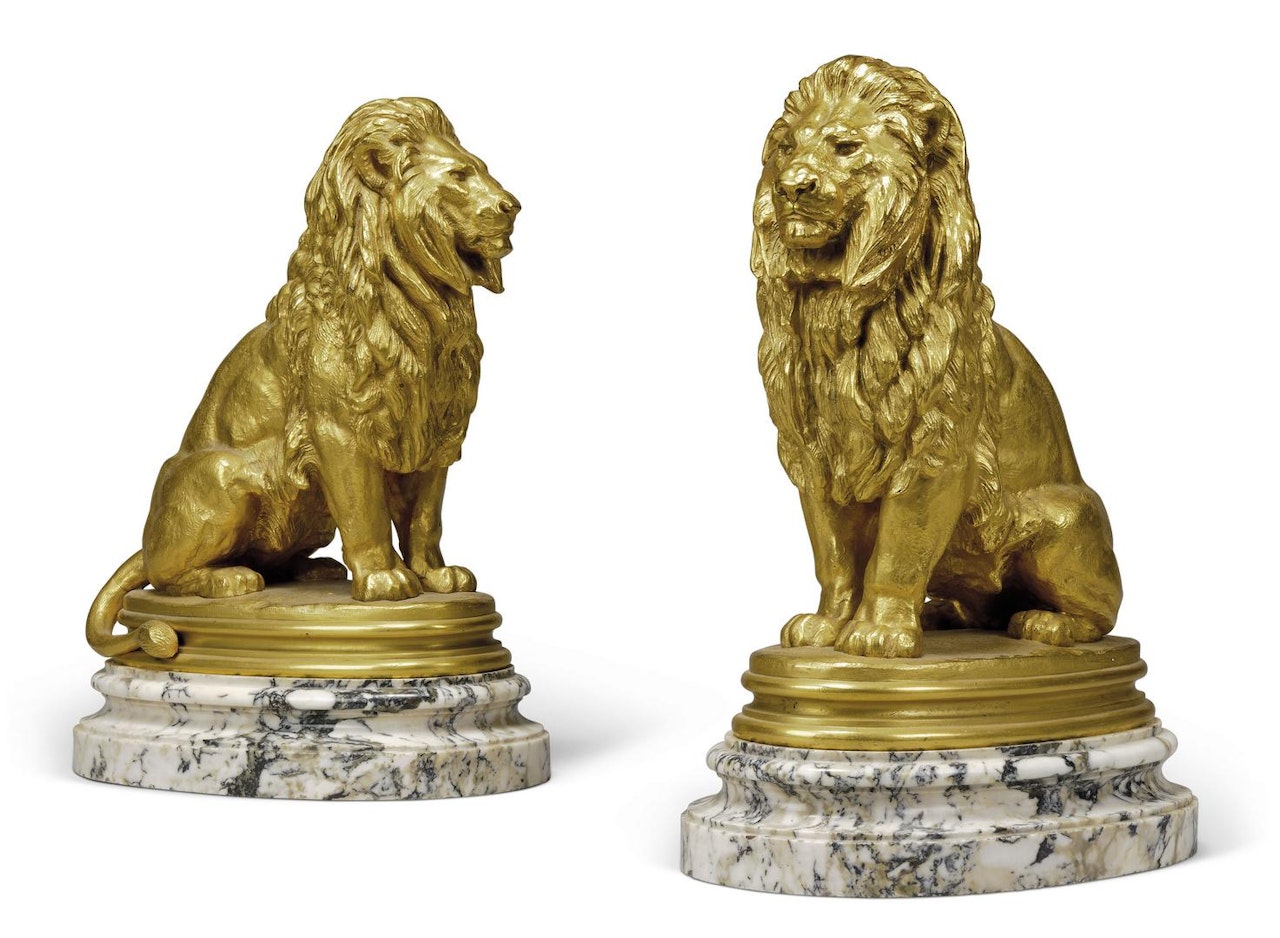 Two models of lions, entitled Lion assis (No 1) by Antoine-Louis Barye