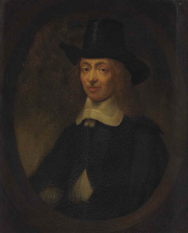 Portrait of a gentleman, half-length, in a painted oval by Nicolaes Maes
