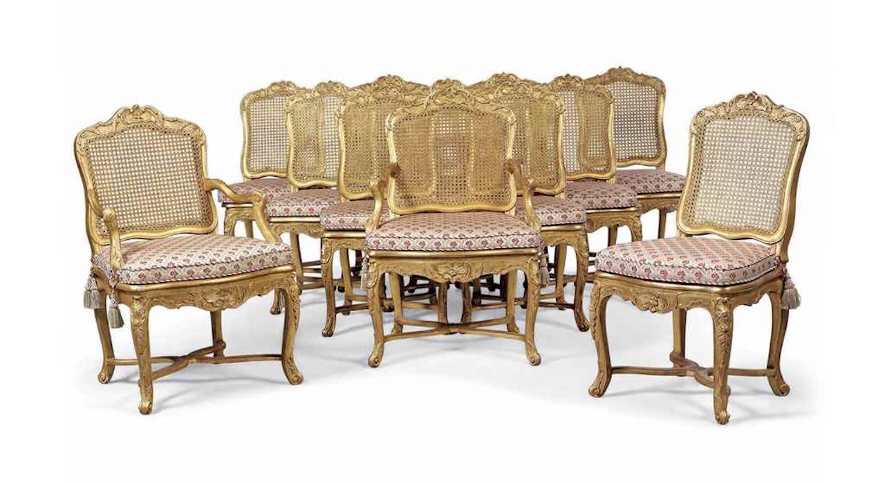 A SET OF TWELVE LOUIS XV GILTWOOD DINING CHAIRS by Anonymous