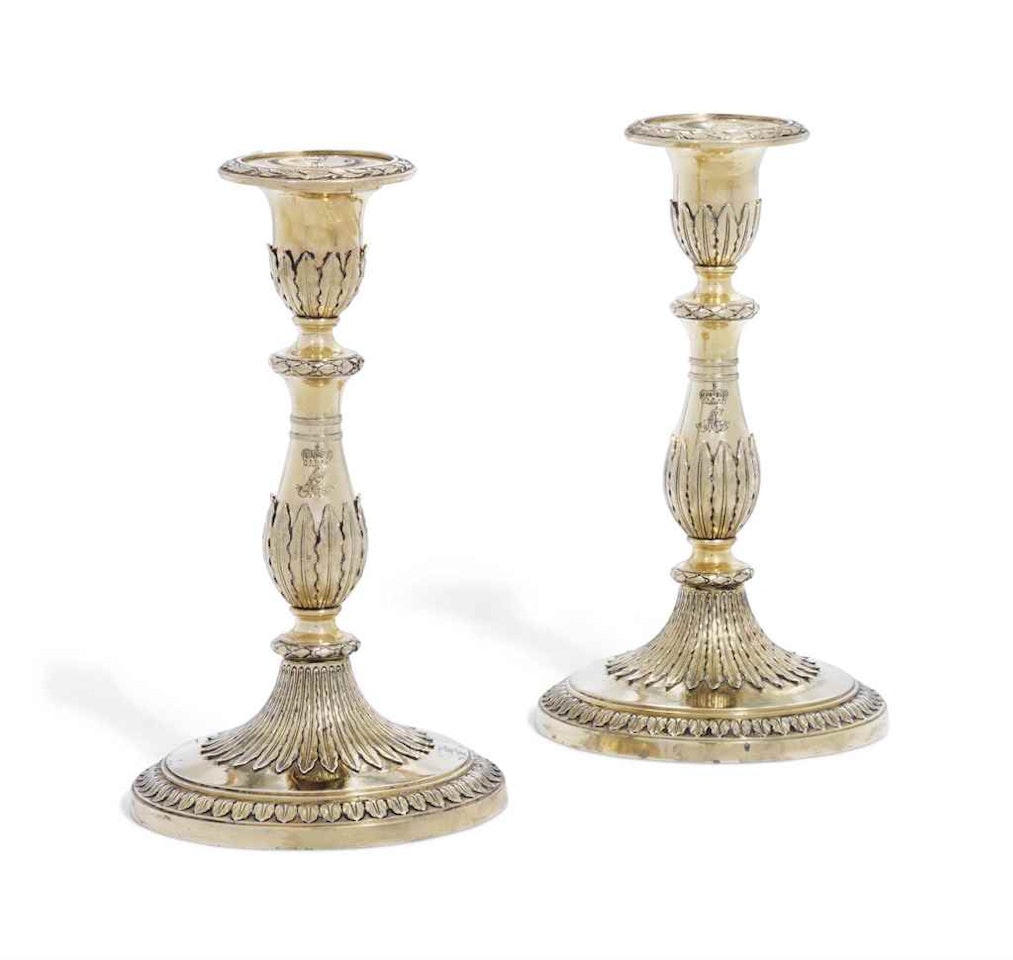 A PAIR OF GEORGE III SILVER-GILT CANDLESTICKS by Anonymous