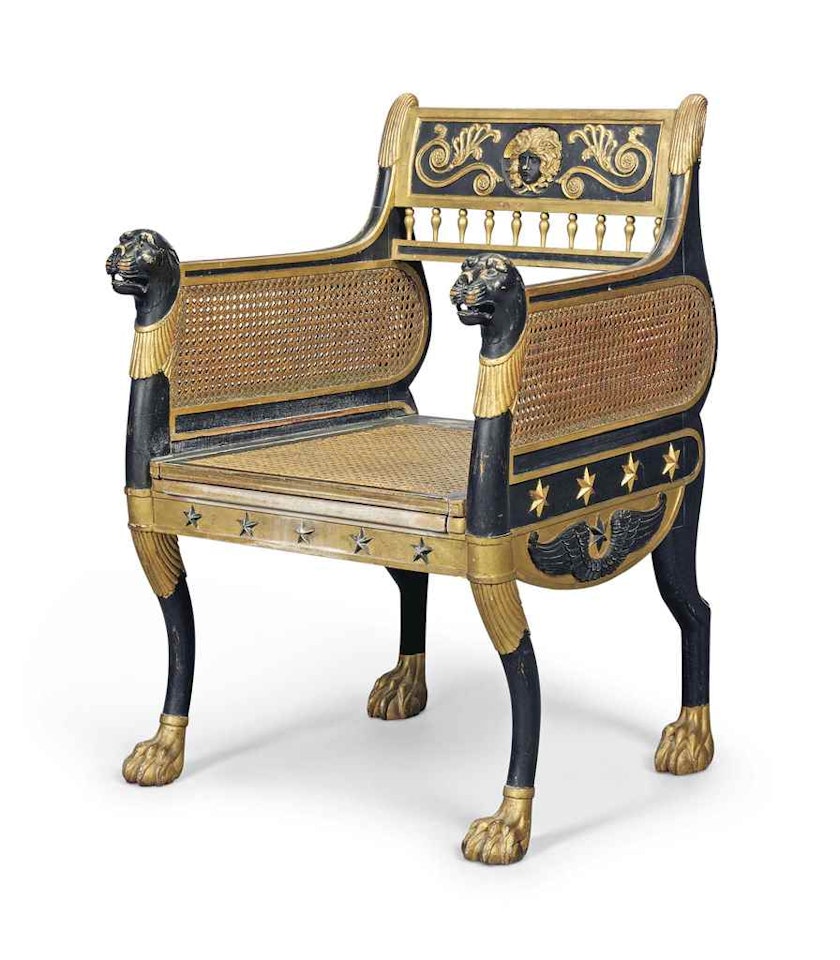 A REGENCY-STYLE EBONISED AND PARCEL-GILT COMMODE CHAIR by Anonymous