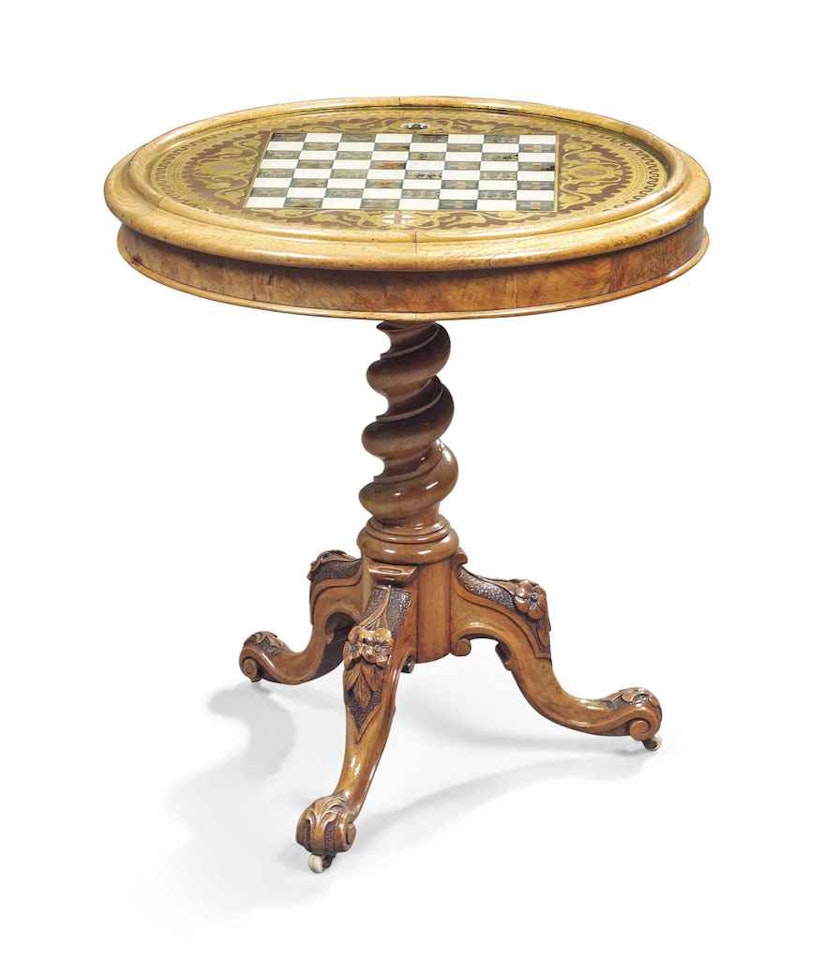 A VICTORIAN WALNUT AND VERRE EGLOMISE GAMES TABLE by Anonymous
