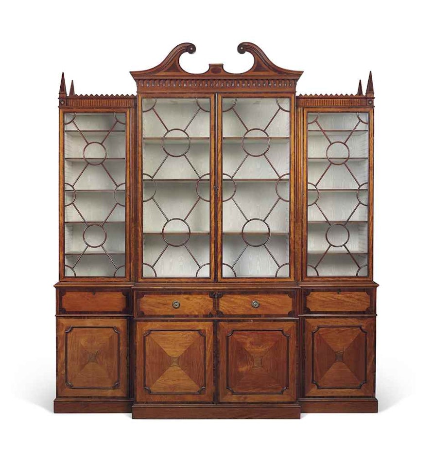A GEORGE III SATINWOOD, GONCALO ALVES AND PADOUK-CROSSBANDED BREAKFRONT LIBRARY BOOKCASE by Anonymous