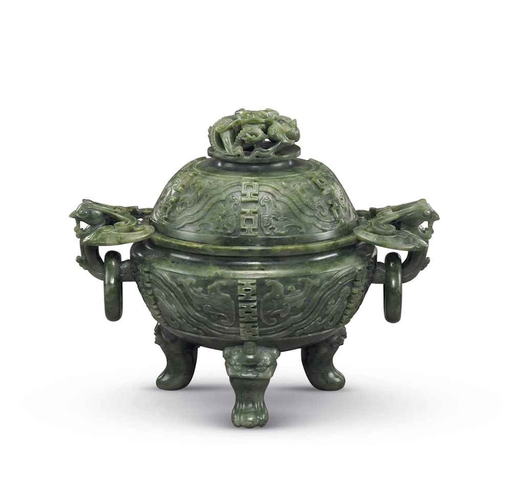 A FINELY CARVED SPINACH-GREEN JADE TRIPOD CENSER AND COVER by Anonymous