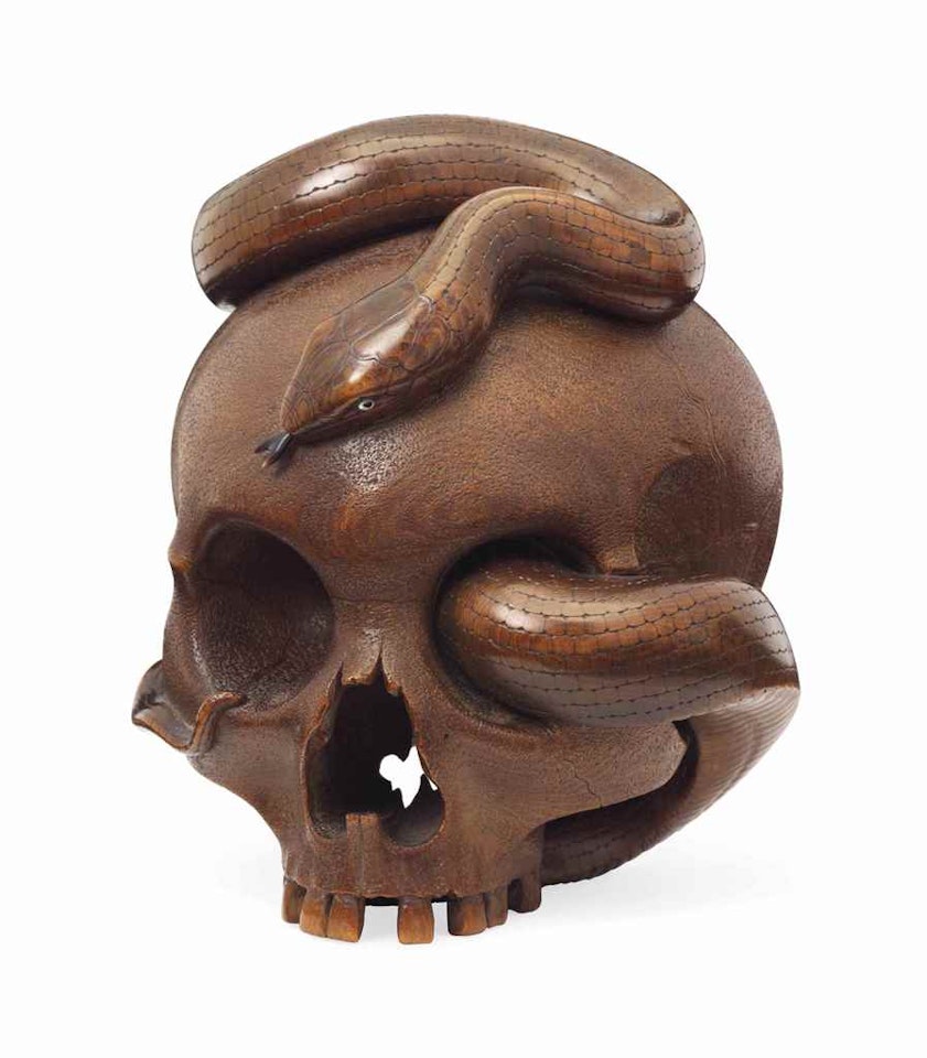 A Fine Carved Wood Okimono in the Form of a Snake Entwined around a Skull by Anonymous
