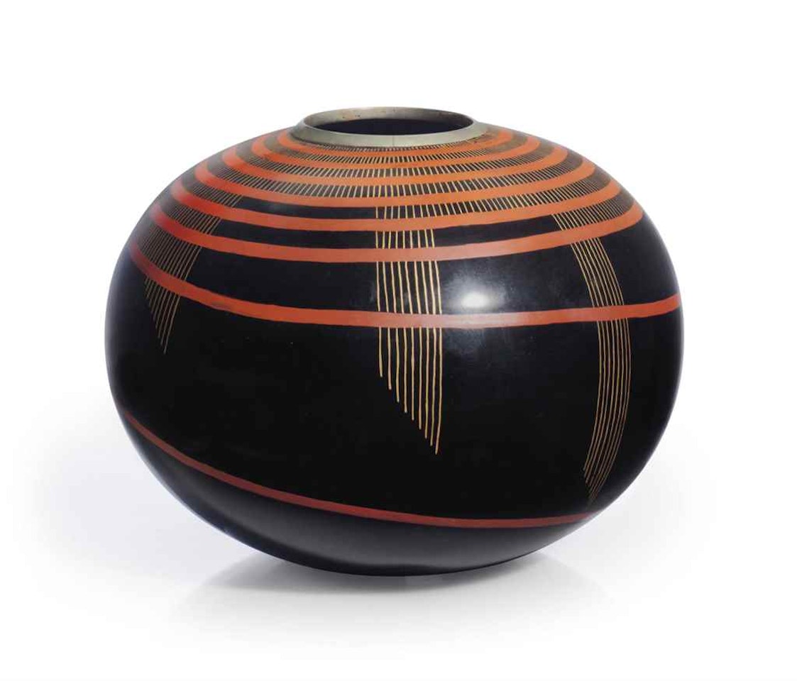 A SPHERICAL VASE by Jean Dunand