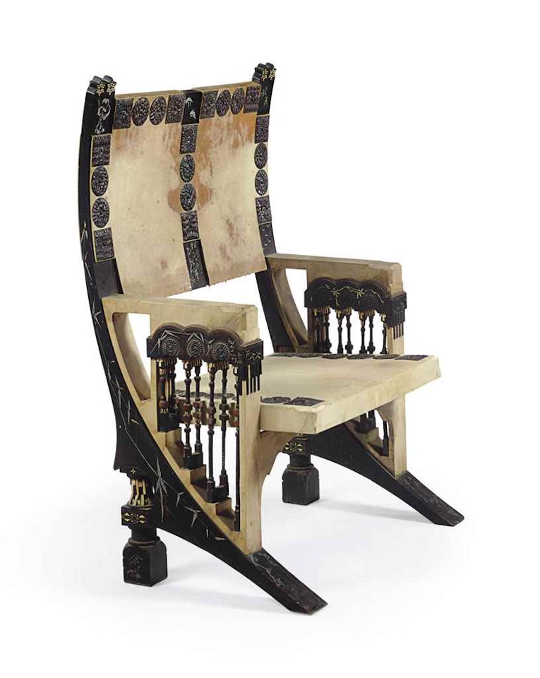 AN ARMCHAIR by Carlo Bugatti