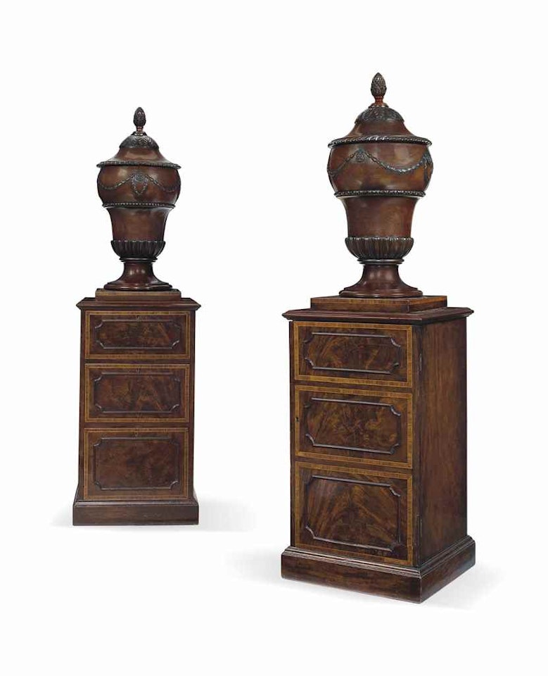 A PAIR OF GEORGE III MAHOGANY URNS ON PEDESTALS by Anonymous