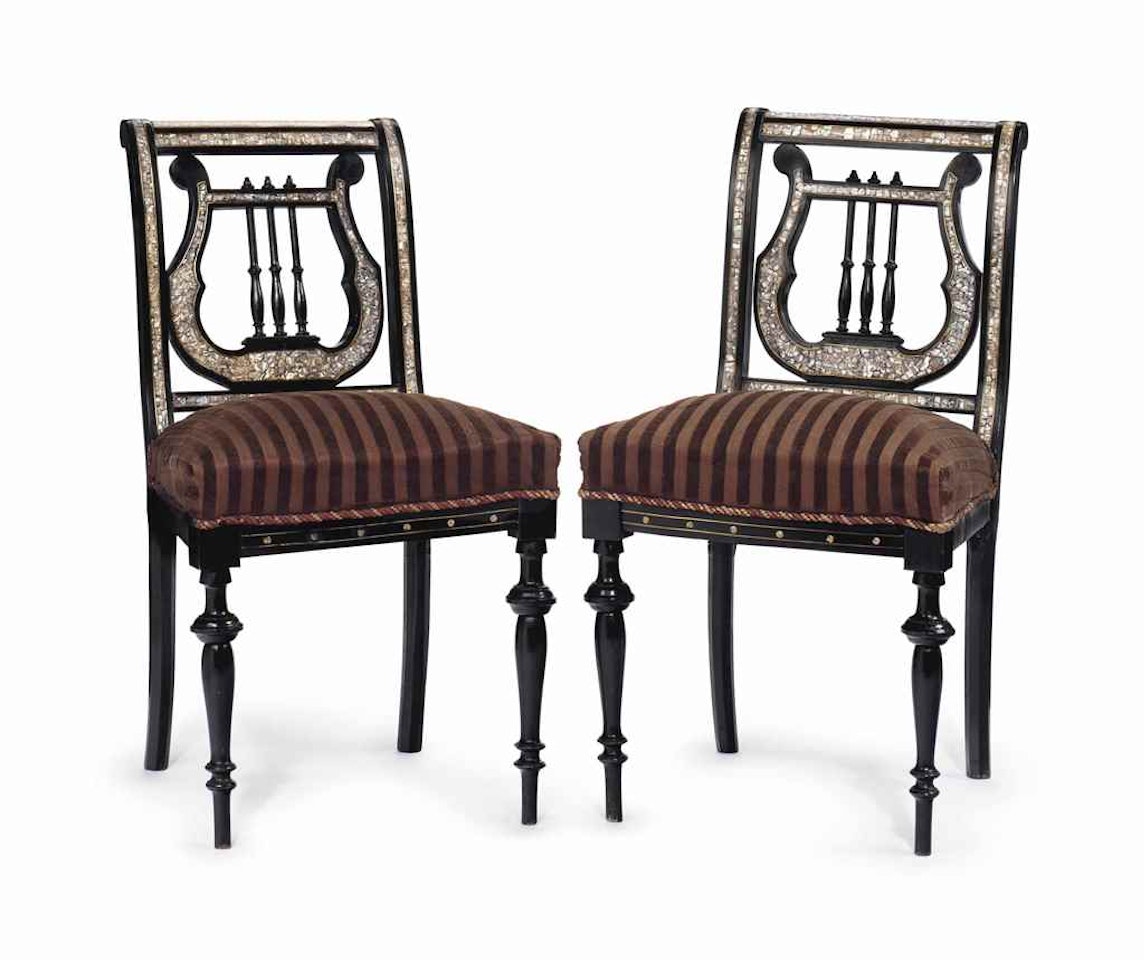 A PAIR OF AESTHETIC MOVEMENT BRASS AND MOTHER-OF-PEARL INLAID EBONIZED LYRE-BACK SIDE CHAIRS by Anonymous