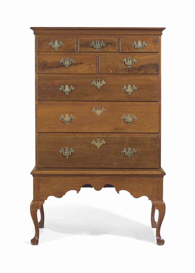 A QUEEN ANNE FIGURED WALNUT CHEST-ON-FRAME by Anonymous