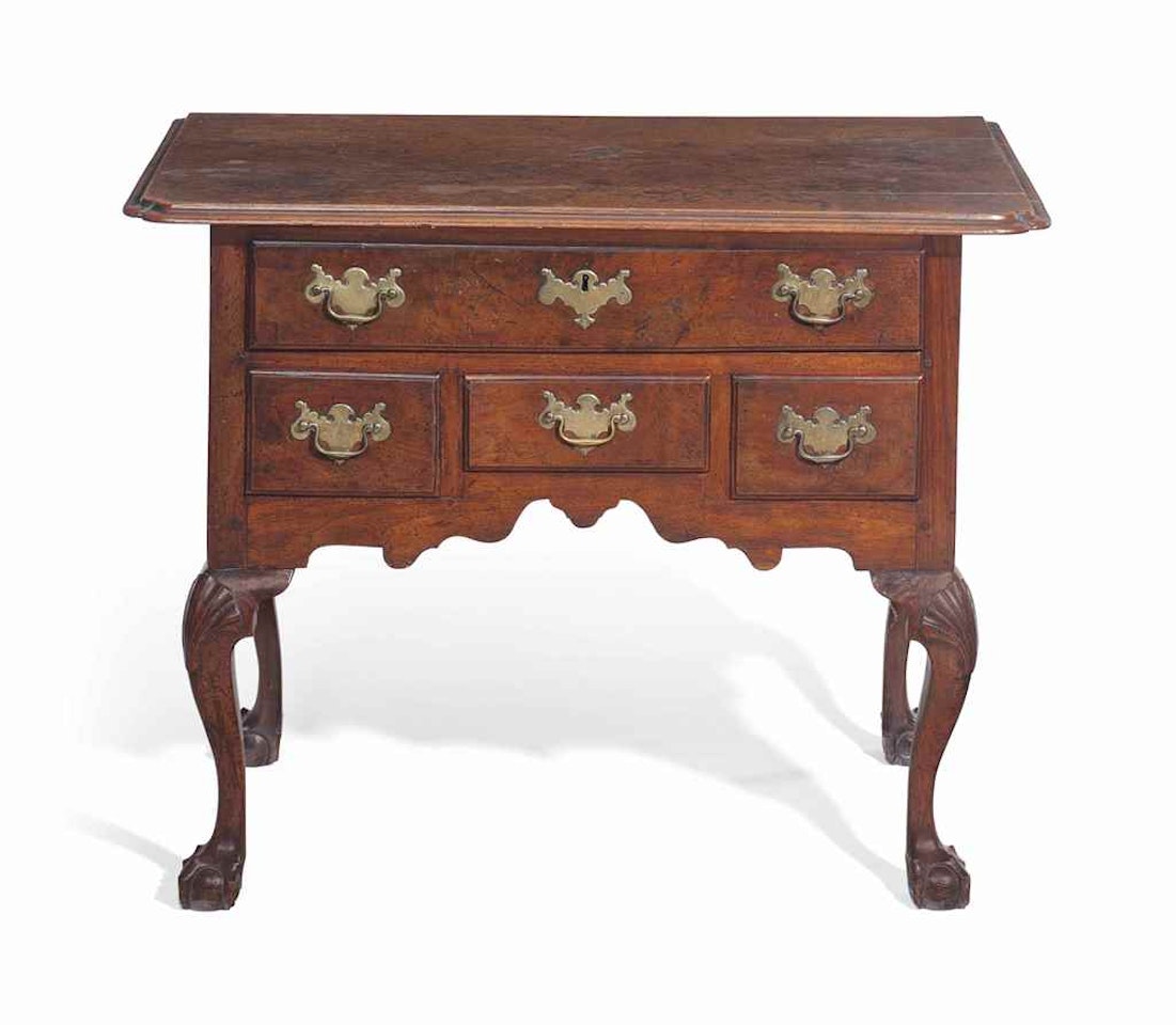 A CHIPPENDALE CARVED WALNUT DRESSING TABLE by Anonymous