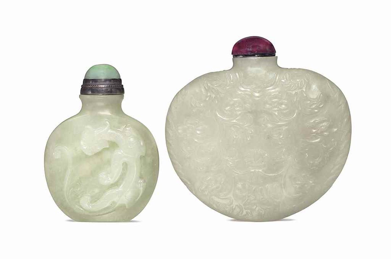 TWO CARVED JADE SNUFF BOTTLES by Anonymous