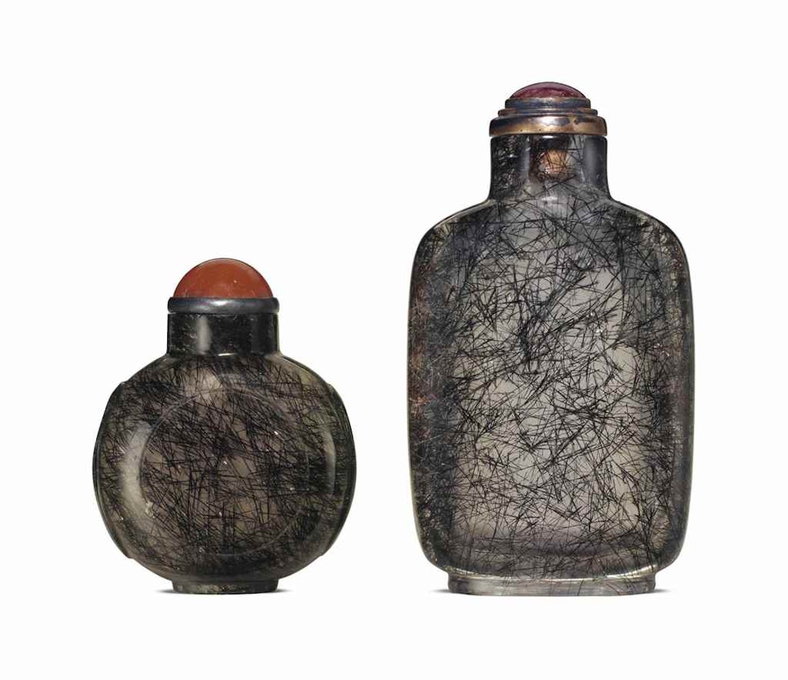 TWO 'HAIR' CRYSTAL SNUFF BOTTLES by Anonymous