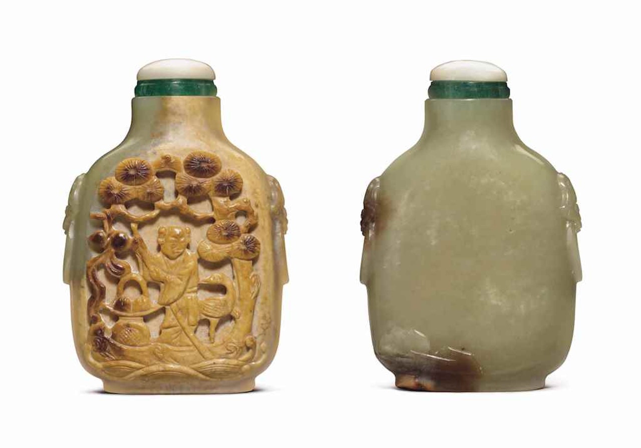 A CARVED GREENISH-YELLOW JADE SNUFF BOTTLE by Anonymous