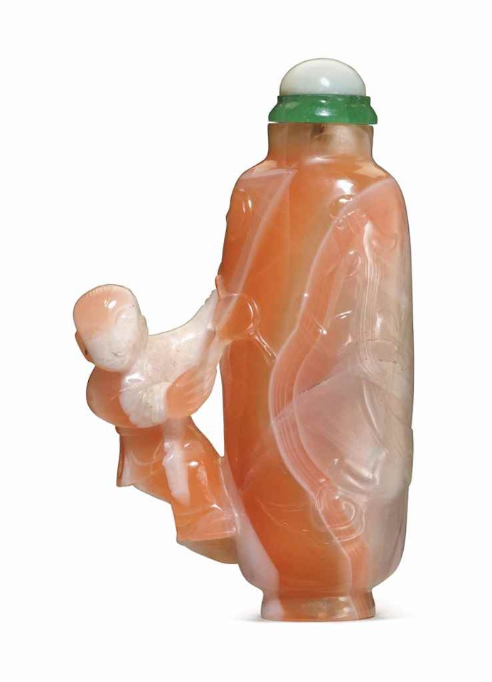 A CARVED CARNELIAN AGATE SNUFF BOTTLE by Anonymous