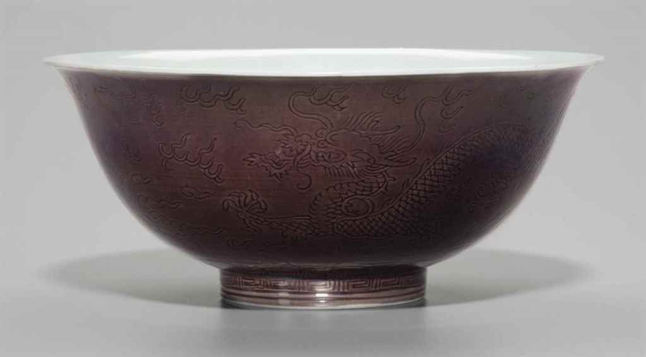 AN AUBERGINE-GLAZED INCISED 'DRAGON' BOWL by Anonymous