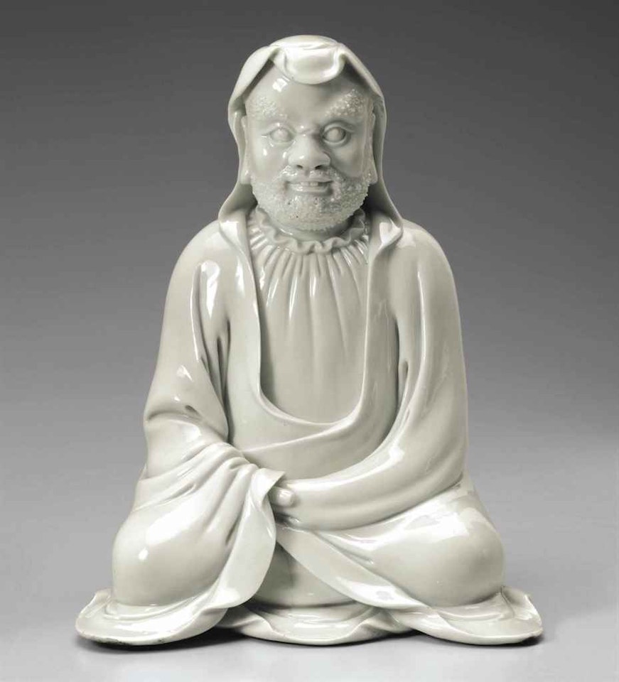 A DEHUA FIGURE OF THE SEATED BODHIDHARMA by Anonymous