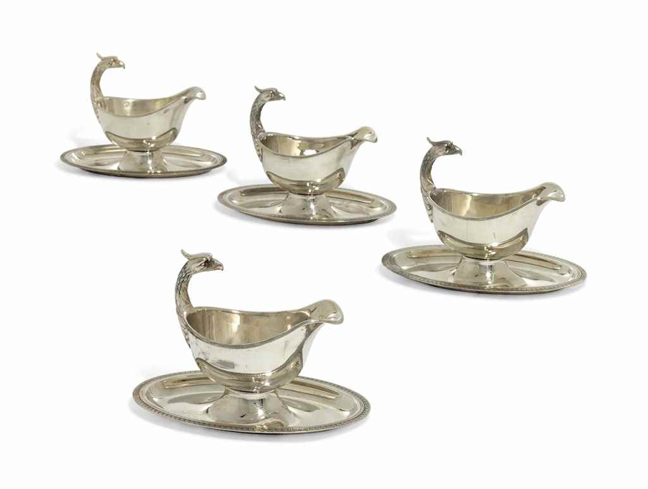 A SET OF FOUR SILVER-PLATED SAUCE-BOATS by Anonymous