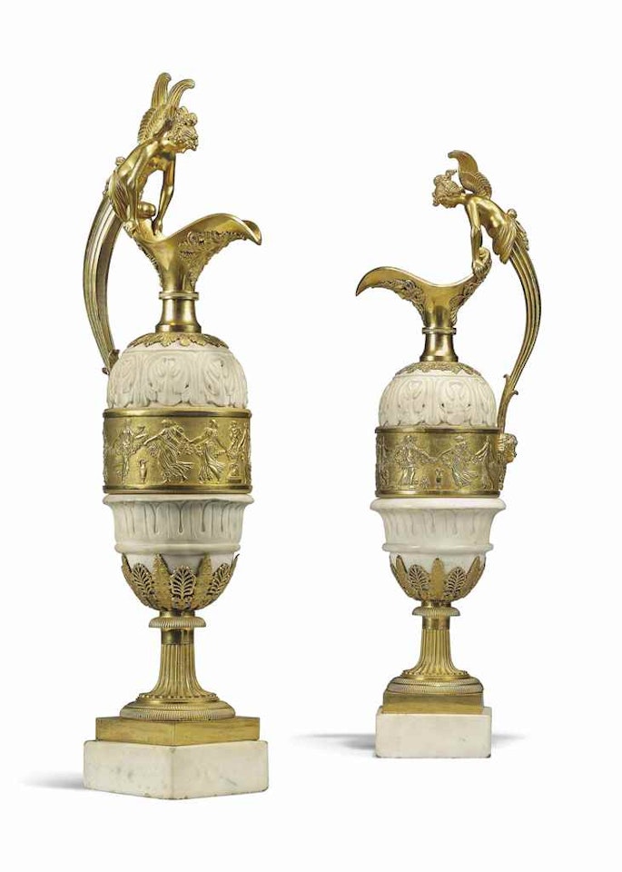 A PAIR OF RESTAURATION ORMOLU AND WHITE MARBLE EWERS by Anonymous