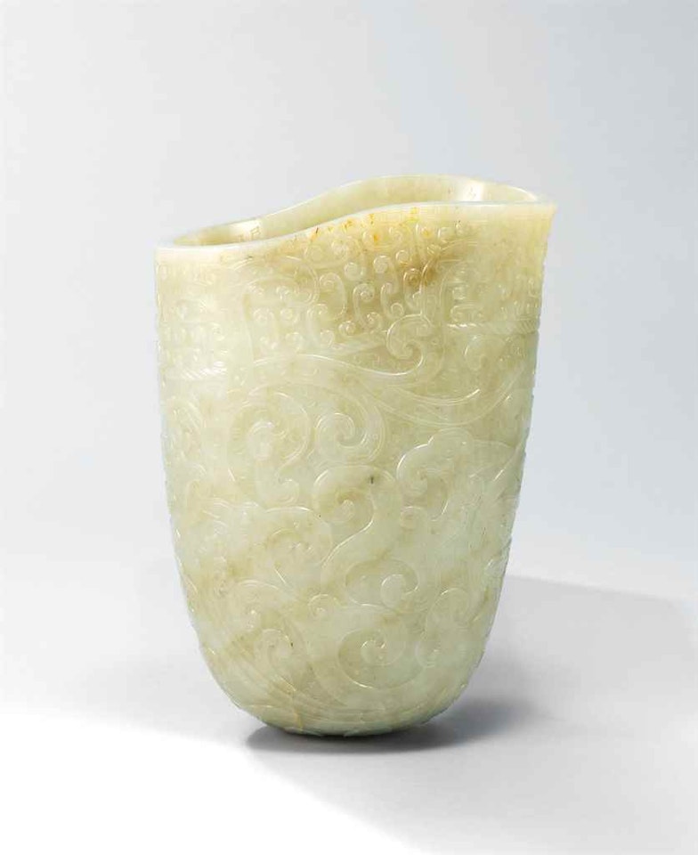 A CARVED PALE CELADON JADE RHYTON, GONG by Anonymous