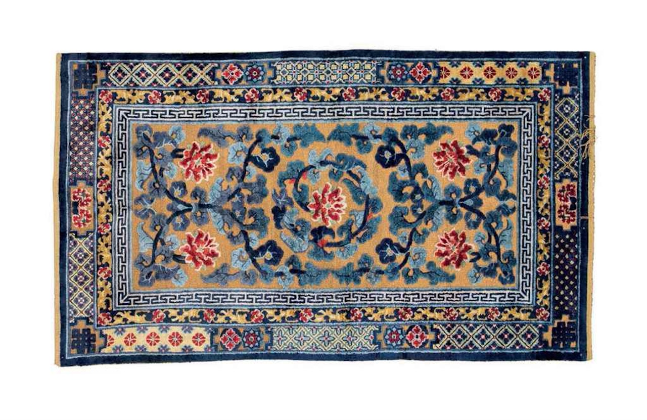 A SILK AND METAL THREAD CHINESE RUG by Anonymous