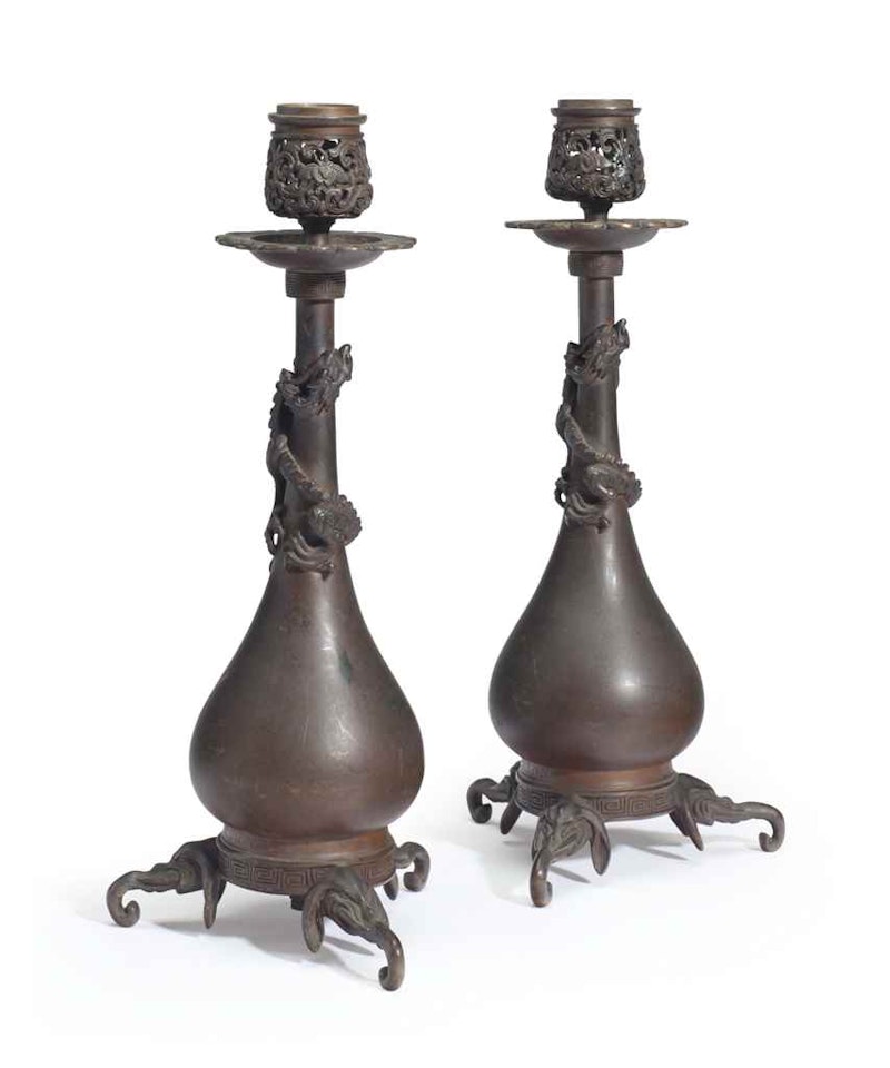 A PAIR OF FRENCH PATINATED BRONZE CANDLESTICKS by Anonymous