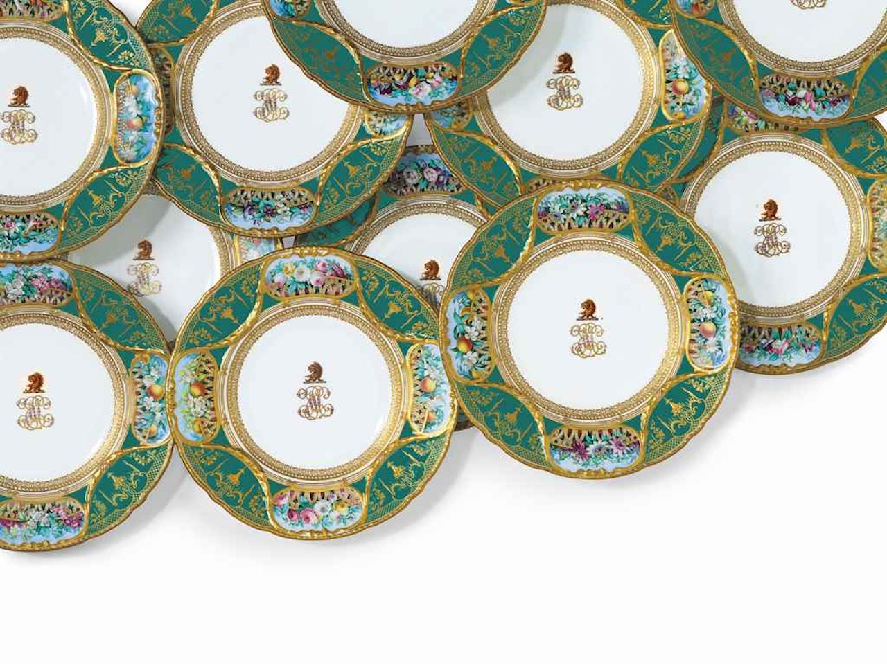 TWELVE COPELAND PORCELAIN MONOGRAMMED AND CRESTED GREEN-GROUND PLATES by Anonymous