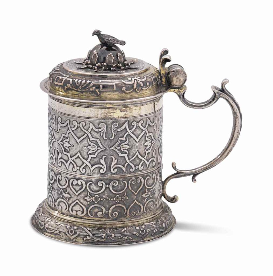 A GERMAN PARCEL-GILT SILVER TANKARD by Anonymous