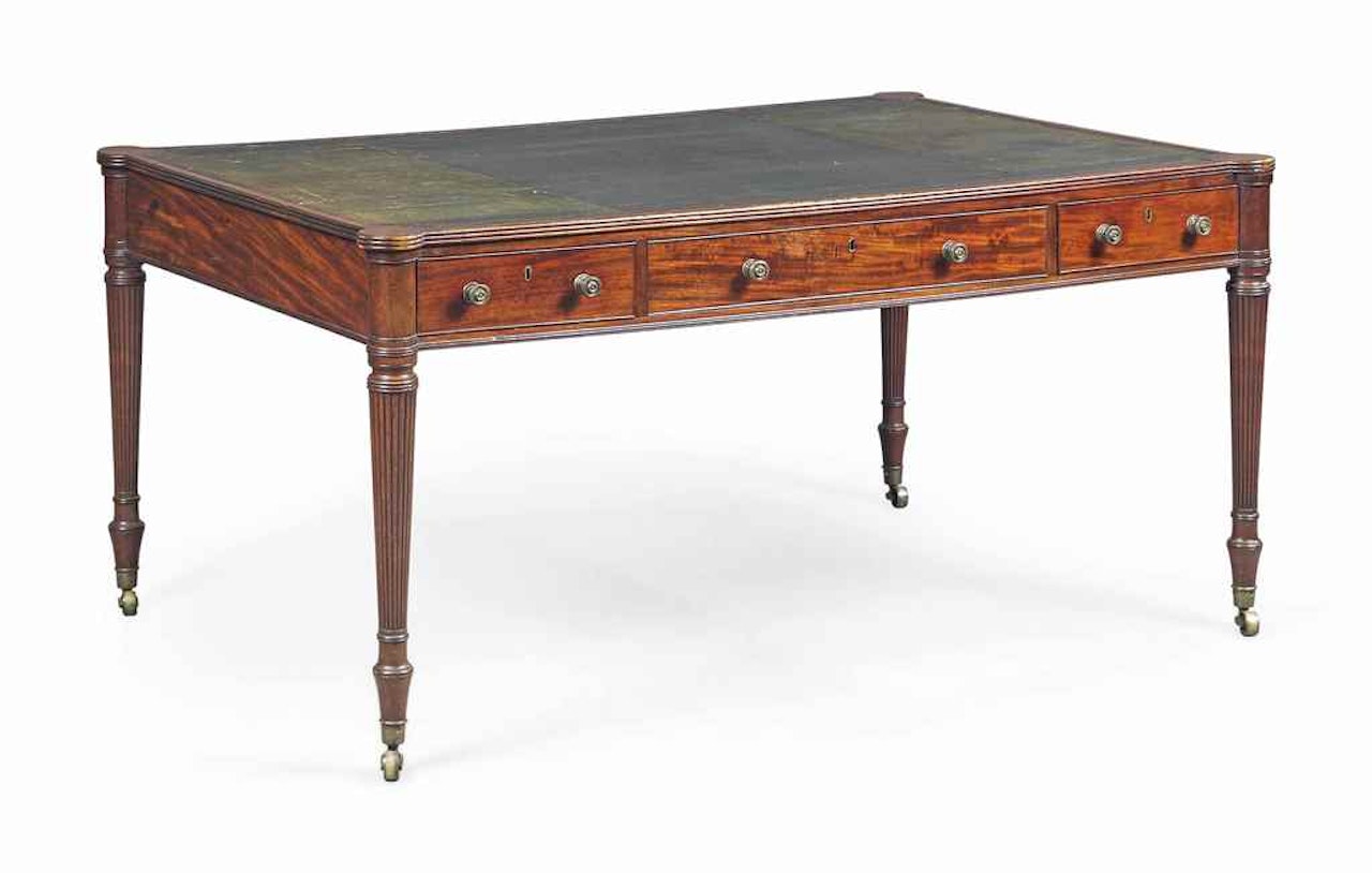 A LATE GEORGE III MAHOGANY WRITING-TABLE by Anonymous