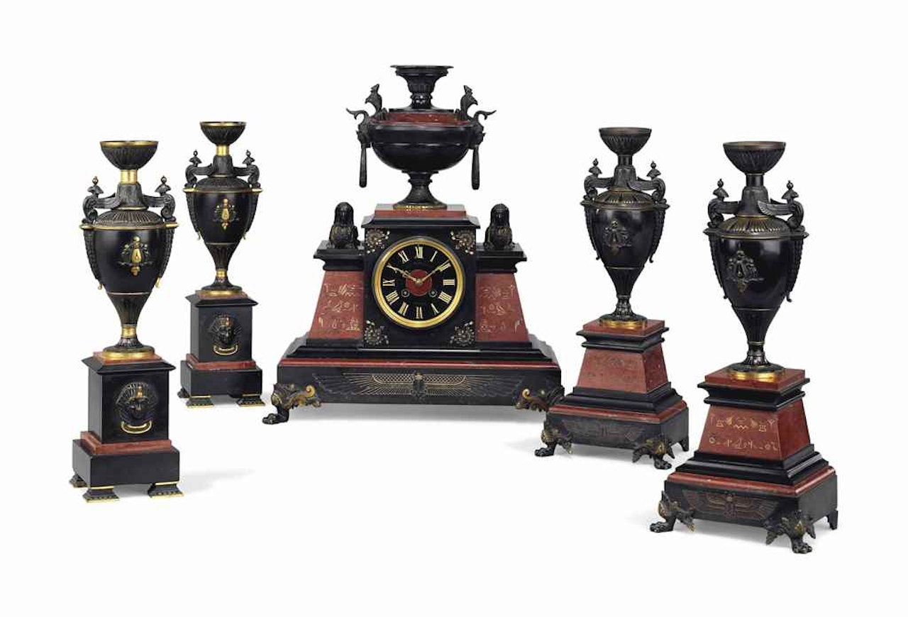 A FRENCH GILT AND PATINATED-BRONZE AND MARBLE FIVE-PIECE CLOCK GARNITURE by Anonymous