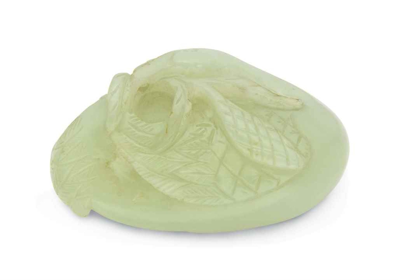 A PALE CELADON CARVING OF A MANDARIN DUCK by Anonymous
