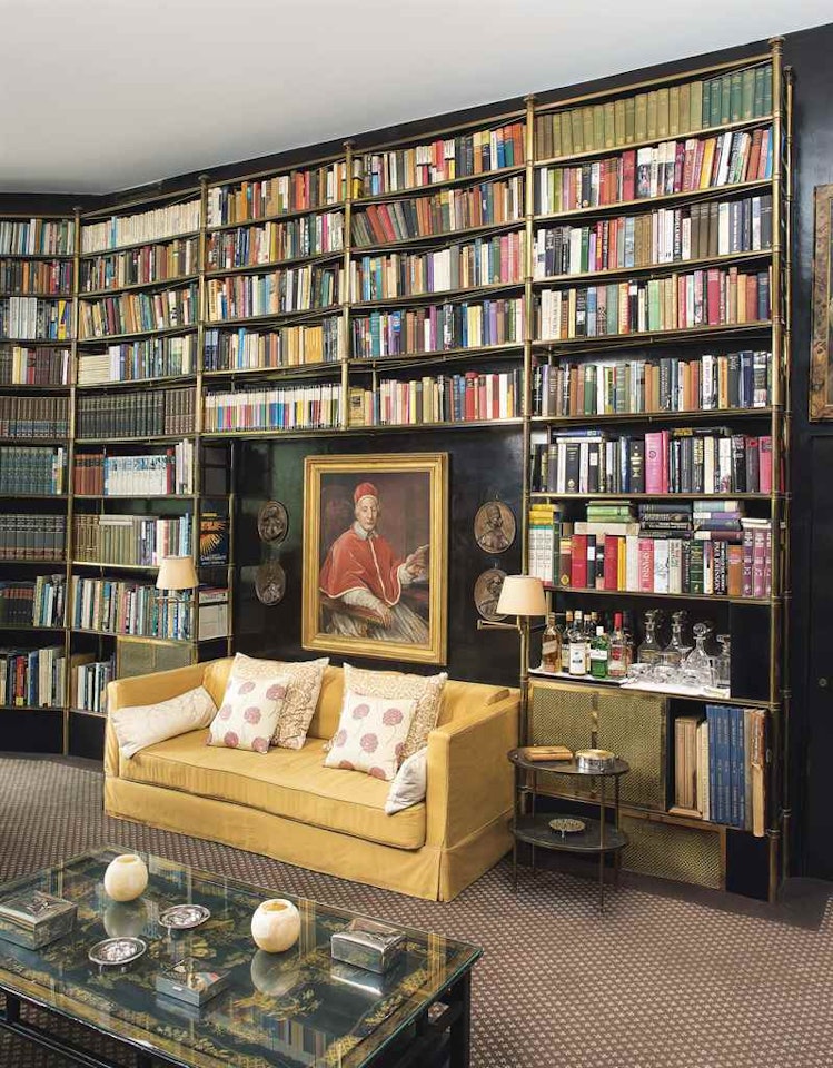 A LACQUERED-BRASS FIVE BAY BOOKCASE by Anonymous