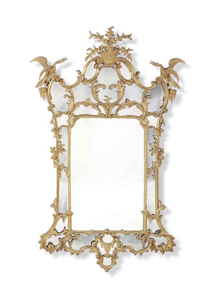 A GEORGE III CARVED GILTWOOD MIRROR by Anonymous