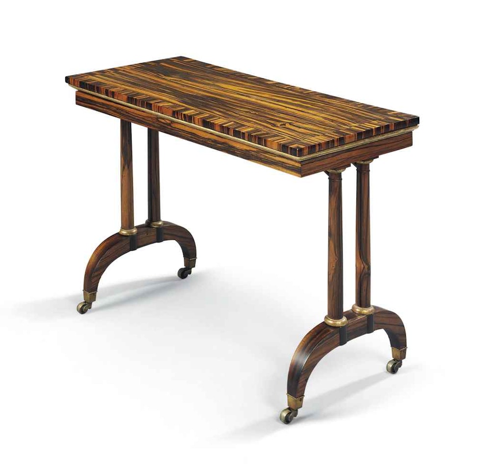 A REGENCY CALAMANDER AND PARCEL-GILT MECHANICAL CARD TABLE by Anonymous