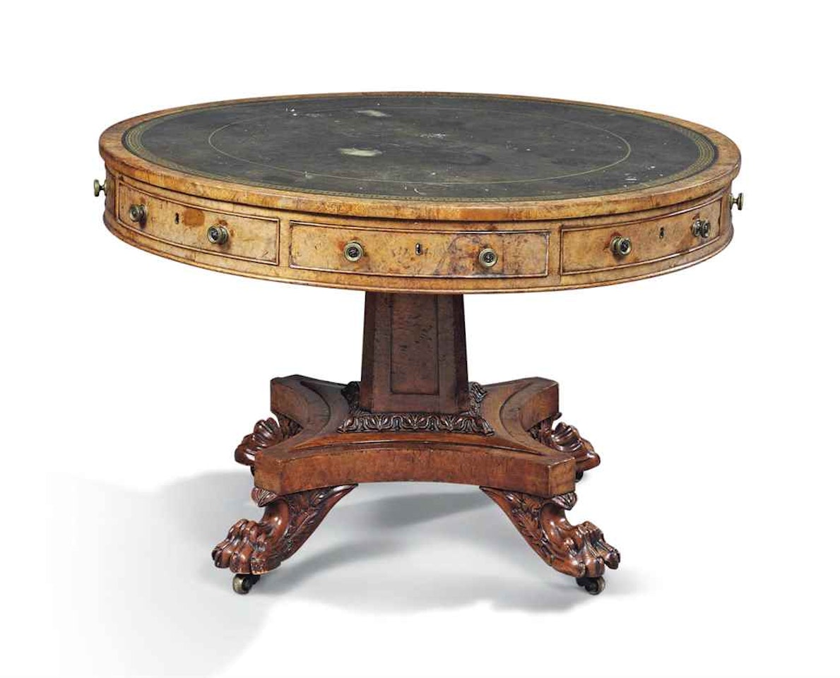 A GEORGE IV POLLARD OAK DRUM LIBRARY TABLE by Anonymous