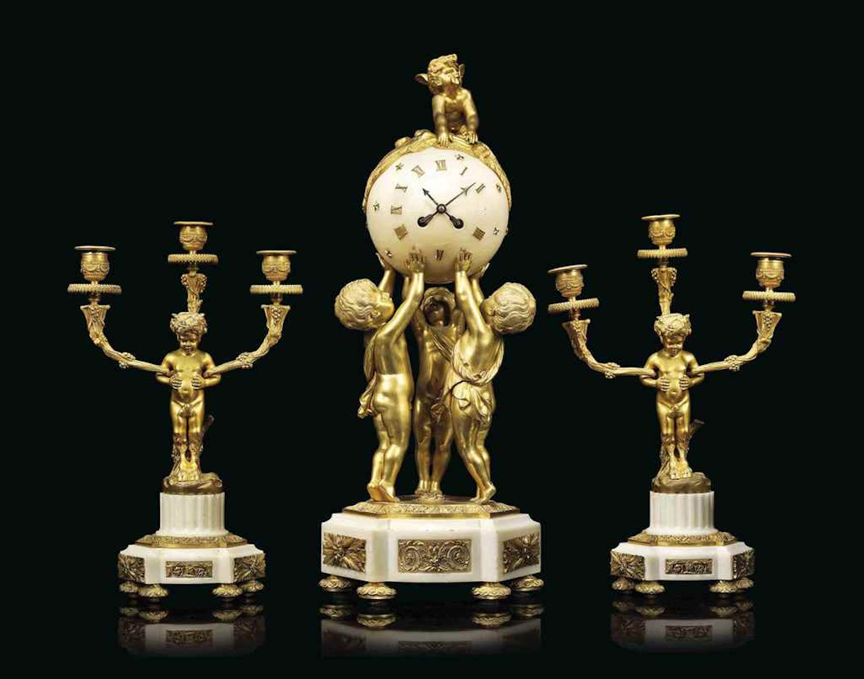 A FRENCH ORMOLU AND MARBLE THREE-PIECE CLOCK GARNITURE by Anonymous