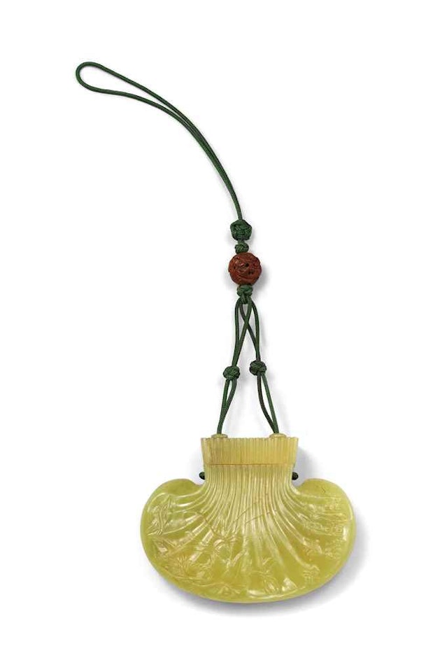 AN INSCRIBED YELLOW JADE POUCH AND COVER by Anonymous