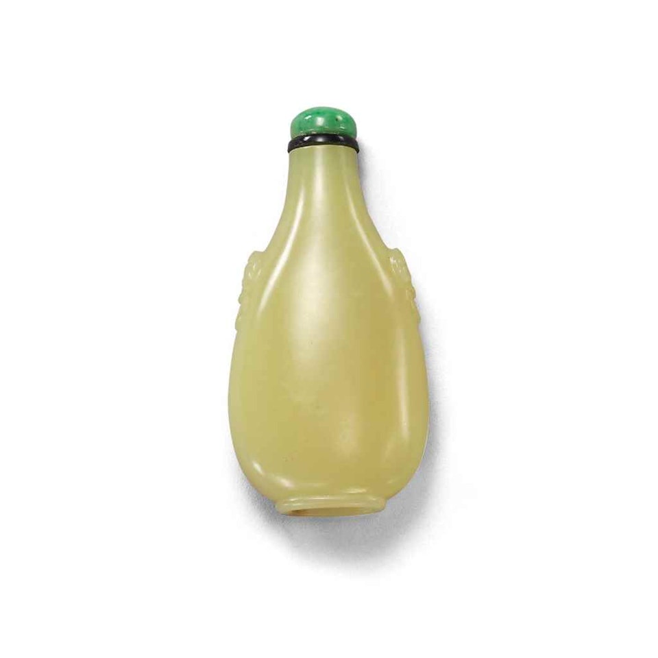 A YELLOW JADE SNUFF BOTTLE by Anonymous