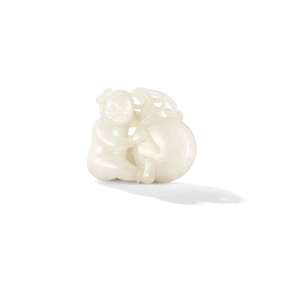 A WHITE JADE 'BOY AND DRUM' PENDANT by Anonymous