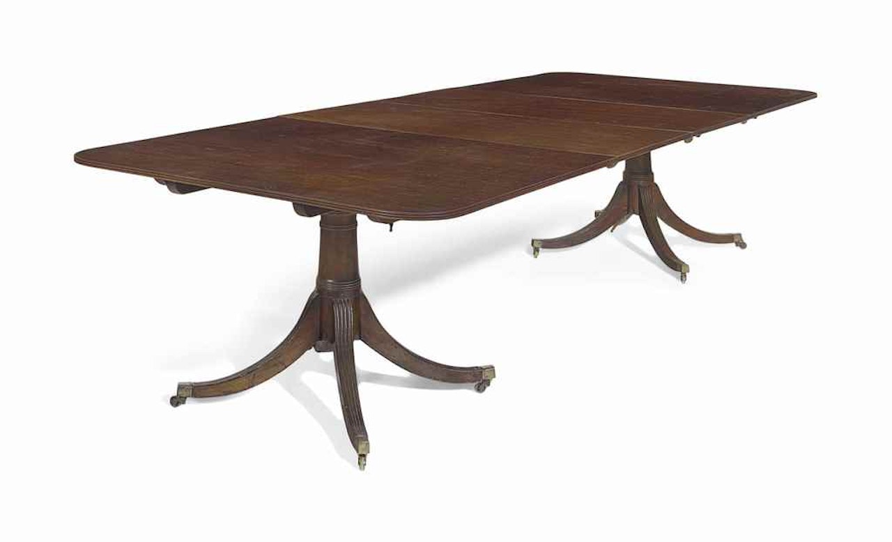 A GEORGE III MAHOGANY DOUBLE-PEDESTAL DINING TABLE by Anonymous