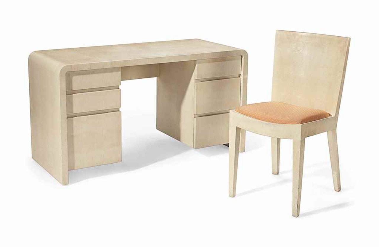 A FAUX SKIN VENEERED DESK AND CHAIR by Anonymous