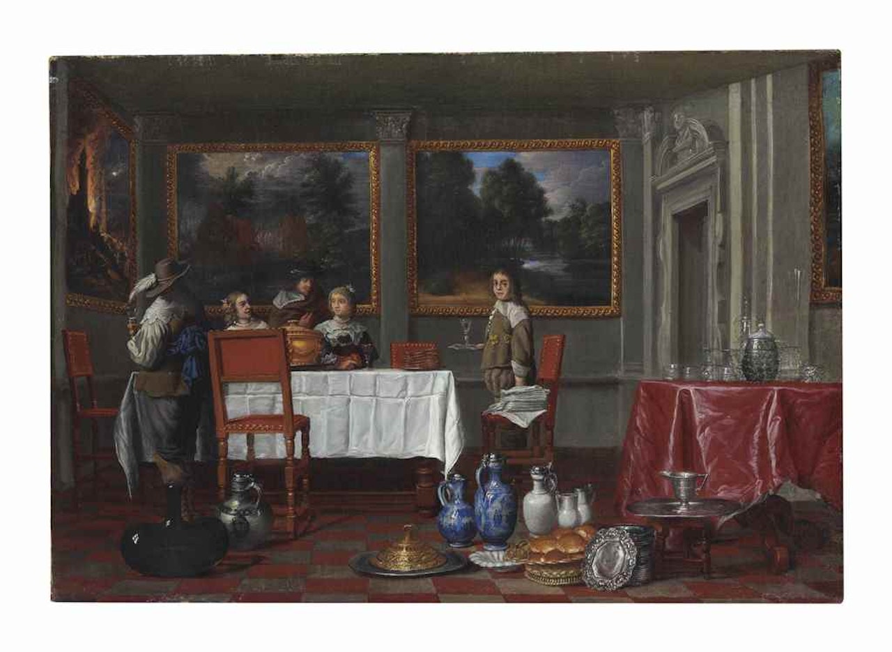 An interior with elegant figures dining by Flemish School