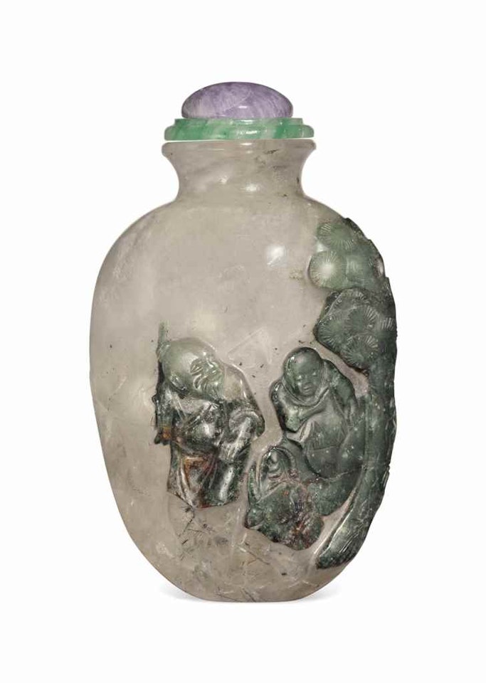 A CRYSTAL AND TOURMALINE RELIEF-CARVED SNUFF BOTTLE by Anonymous