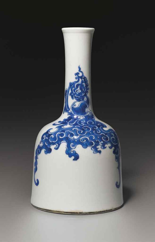 A BLUE AND WHITE MALLET VASE by Anonymous