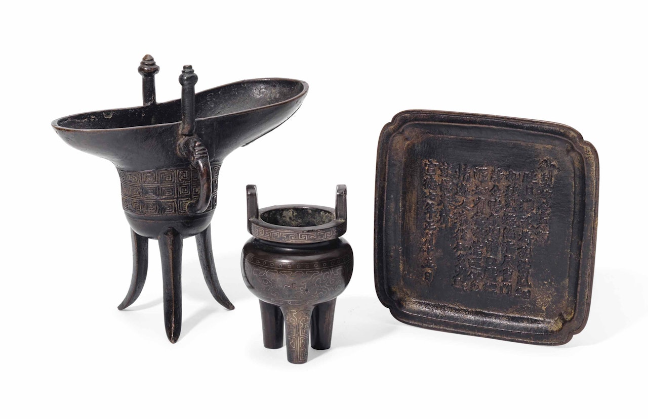 AN ARCHAISTIC BRONZE JUE, A BRONZE INSCRIBED TRAY, AND A SMALL SILVER WIRE-INLAID BRONZE DING by Anonymous